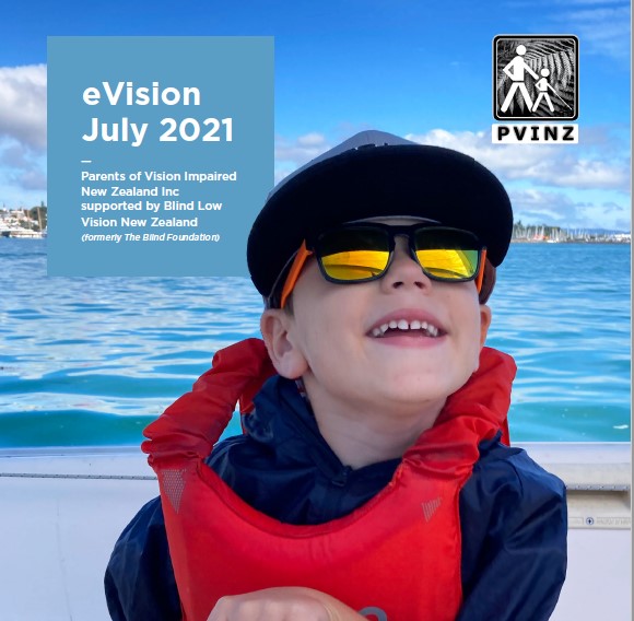 a young child is wearing sunglasses and a life jacket and is sitting on a sailboat on the water. he is smiling